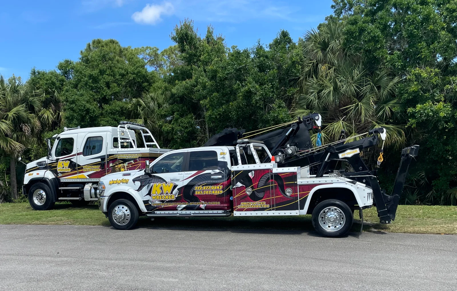 KW Wrecker Service medium-duty fleet vehicles with custom branded wraps